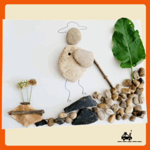 Tableau façon land art représentant un enfant qui marche dans la montagne. Il est entièrement réalisé avec des éléments naturels : cailloux, feuilles, bâtons, fleurs.